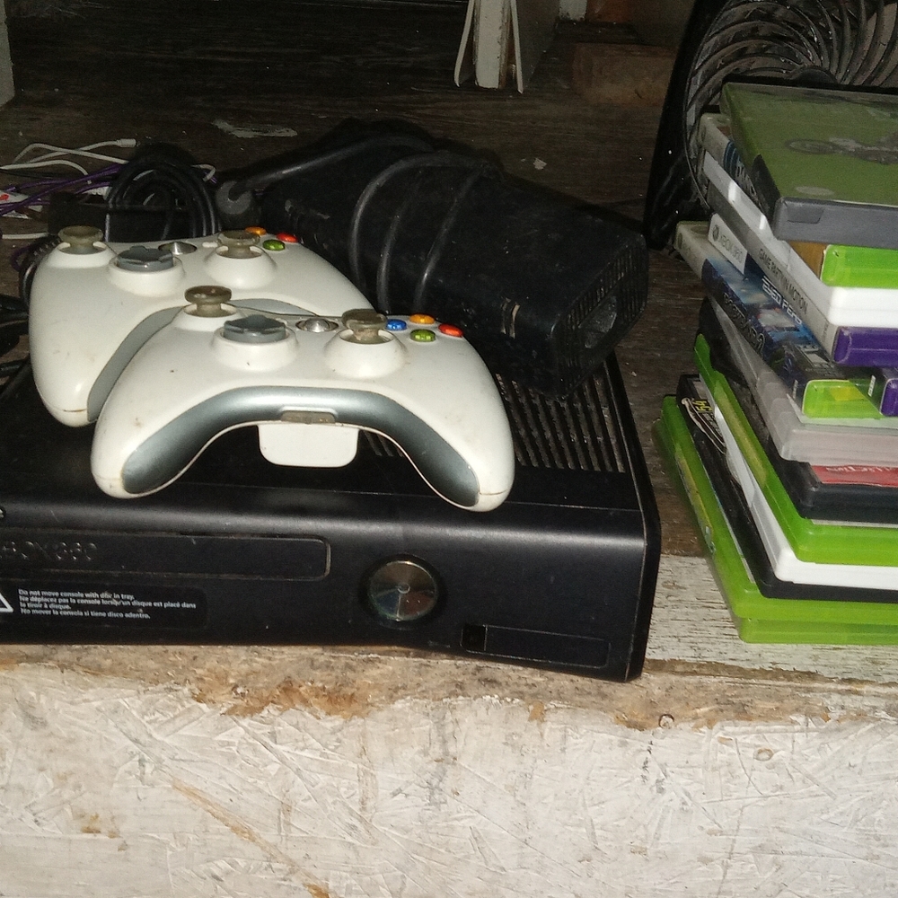 Xbox 360 with two wireless controllers and 10 games